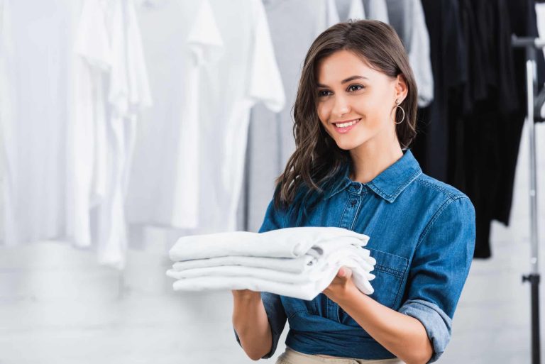 Woman holding cotton t-shirts