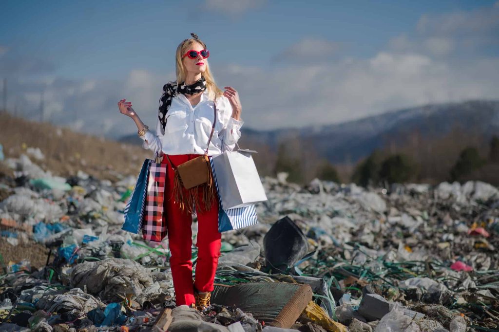 Modern woman buying fashion on landfill