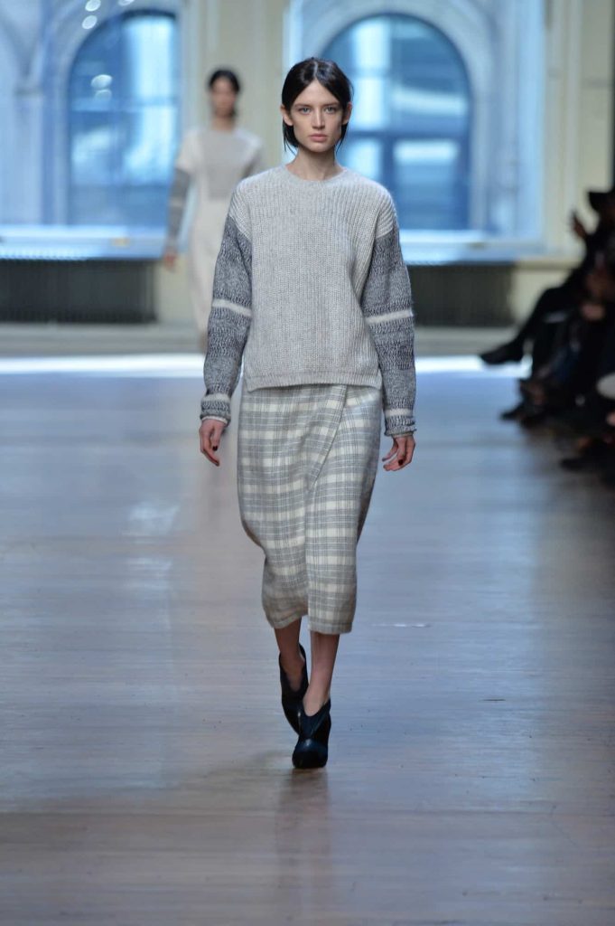 A woman model walks wearing mohair in a fashion show